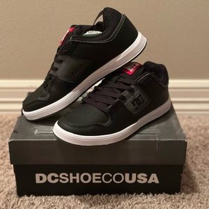 Boys DC black shoes, size 4. Never worn. NWT